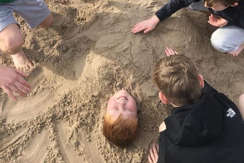 Jonny buried in the sand